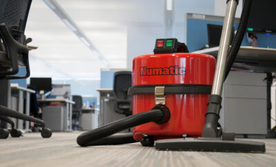 Numatic Commercial Dry Steel Top Vacuum In An Office
